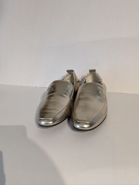 The TORY BURCH Tibi Metallic Silver Slip-On Loafers
